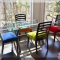 F23. Glass top kitchen table and 4 chairs. 29"h x 60"w x 36"d 